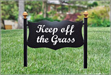 Keep off the grass sign on a lush lawn