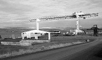 (Dean Brickey) Containers are staged at the Port of Umatilla in preparation for loading with poplar logs bound for China from the Potlatch Corp. tree farm near Boardman.