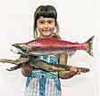 In a 1996 photo, a schoolgirl holds a stuffed 'Lonesome Larry', the only sockeye salmon to return to Stanley Basin in 1992. File - The Spokesman Review