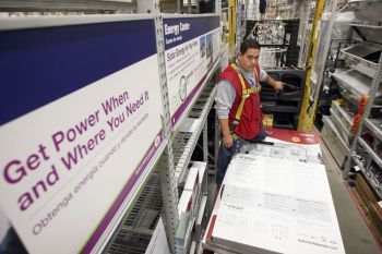 SUN POWER: With growing demand for more energy efficient homes, the home improvement chain Lowe is stocking its California shelves with solar products for do-it-yourselfers. (David McNew/Getty Images)