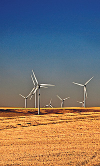 Wind turbines rise above the eastern plains of Oregon. With the constantly rising cost of energy, businesses look into alternatives and renewable-energy solutions.