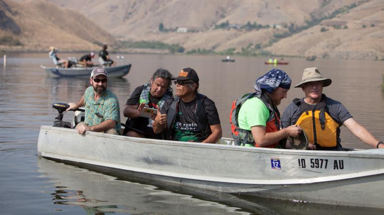 Members of the Nimiipuu (Nez Perce) take part in the Free the Snake Flotilla in protest of four dams on the lower Snake River. The dams have been blamed for warming the water on the river and killing off millions of salmon. (Photo by Mike Lee)