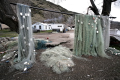 (Andy Sawyer) Gill nets hang like a curtain in front of the concrete slab that was once the home of Celilo Chief Tommy Thompson.