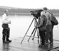 (Photo David N. Seelig) Idaho Gov. Jim Risch speaks with media representatives Friday at Redfish Lake near Stanley, where he helped release sockeye salmon in an effort to sustain the species' continued survival.