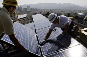 Installation of solar panels on rooftops.