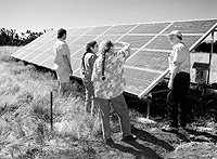 The small solar system shown here is saving Scotts Mills, Ore., dairywoman Barbara Spinola, second from left, considerable money on electricity. Others in photo include, from left, Len O'Donovan, Energy Trust of Oregon, Spinola's sister, Christine, and Ron Summers, owner of Summers Solar Systems.