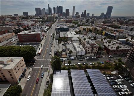 (photo: Lucy Nicholson) Solar panels are seen in the parking lot of 1929 building Walter J Towers, near downtown Los Angeles.