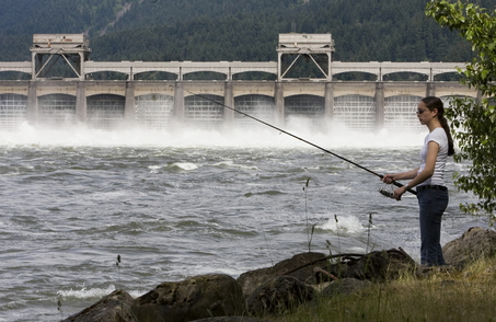 (Doug Beghtel) Ashley Soto of Albany fishes below Bonneville Dam during the high spring river flow.