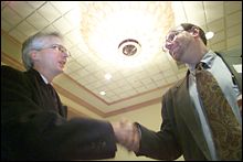 Acting BPA Administrator Stephen Wright, left, talks with Stan Berman, program co-chairman, during a conference in Bellevue.