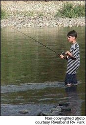 Young camper fishs the Twisp River.