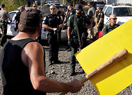 (Don Ryan/Associated Press) Longshoremen in Longview, Wash., faced off with police in a rare showing of union militancy.