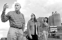 Kim Puzey, executive director of the Port of Umatilla, gives a tour of the port to Monica Isbell of Hillsboro and Windy Pang, general manager and founder of Chongqing Kingstar Science and Trade Co., of Chongqing, China on Friday. Staff photo by E.J. Harris.