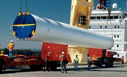  (The Columbian) Work crews at the Port of Vancouver offload a wind turbine tower from a ship. The ability to handle wind-energy cargo has been a boon for the port.